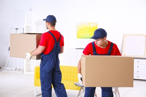 Removal team preparing a moving van for a home move in Collierrow