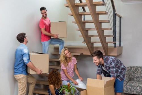 Commercial office move with boxes and desks prepared for transport
