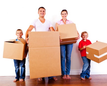Packed boxes and furniture ready for transport in Collierrow