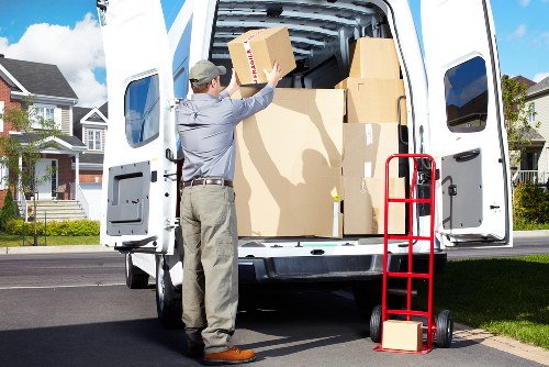 Professional man and van handling access challenges in Collierrow