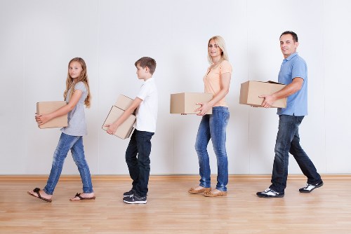 Furniture and boxes being loaded into a removals van