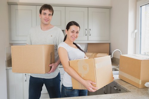 Professional movers handling furniture during a Collierrow relocation